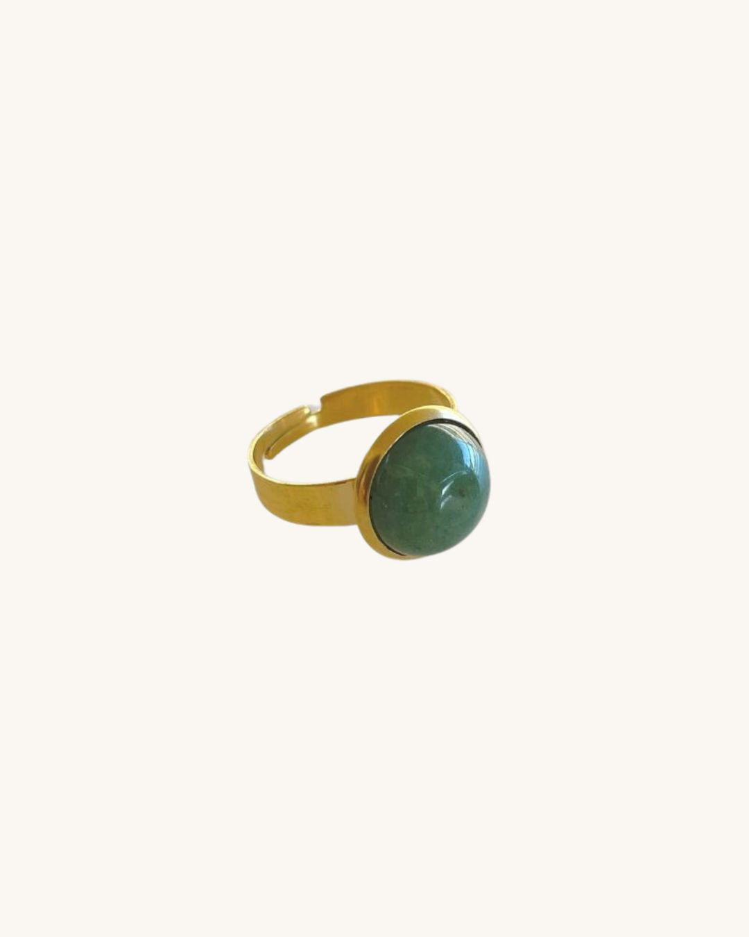 A gold waterproof adjustable band ring with an aventurine stone