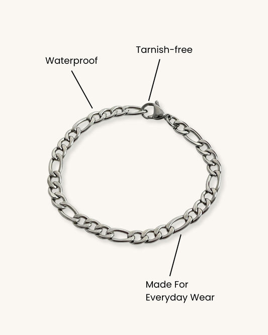 Bold figaro chain bracelet in silver on a white background
