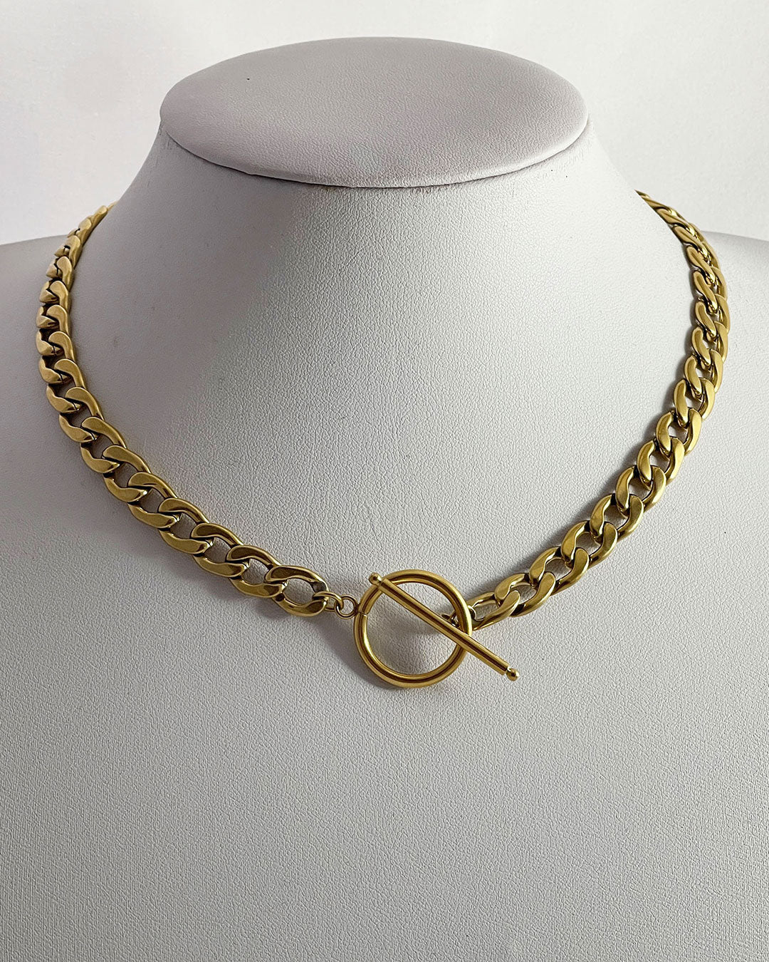 A chunky gold toggle necklace