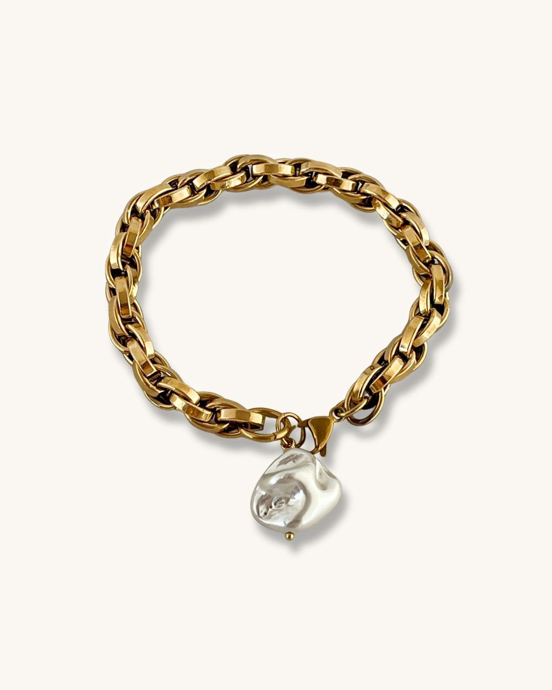 A chunky chain bracelet with shell pearl charm