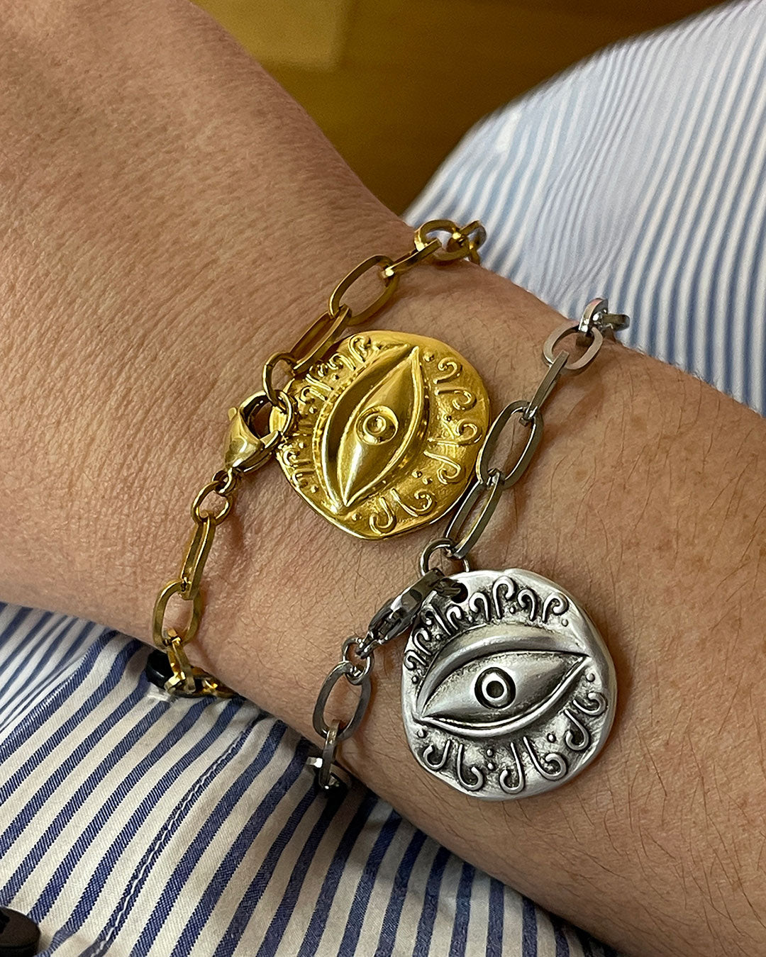 Evil eye charm bracelet with paperclip chain and a round eye charm in gold and silver