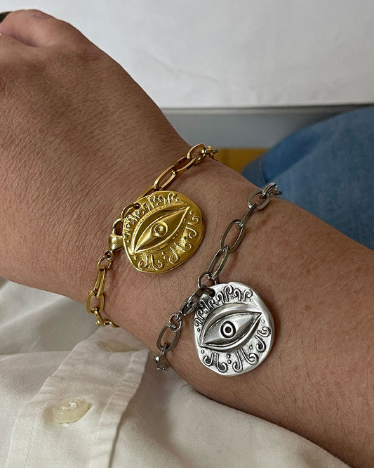 Evil eye charm bracelet with paperclip chain and a round eye charm in gold and silver