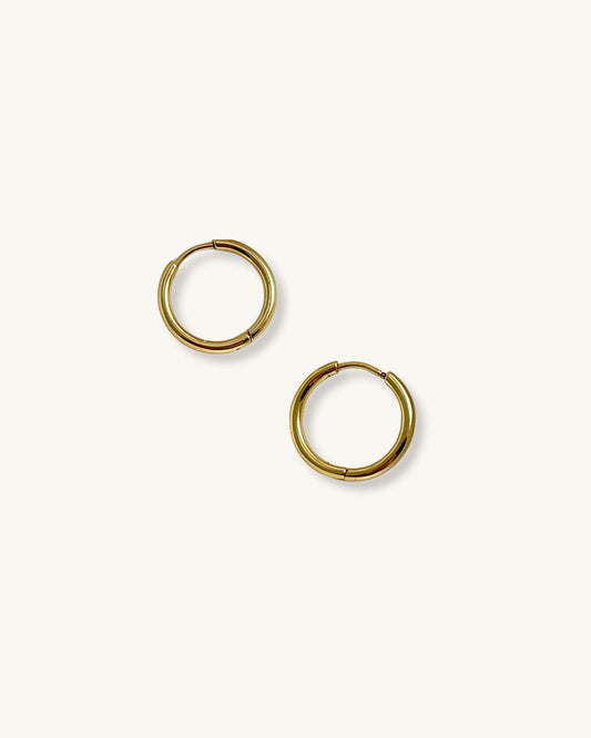 Gold hoop earrings 14mm on a white background