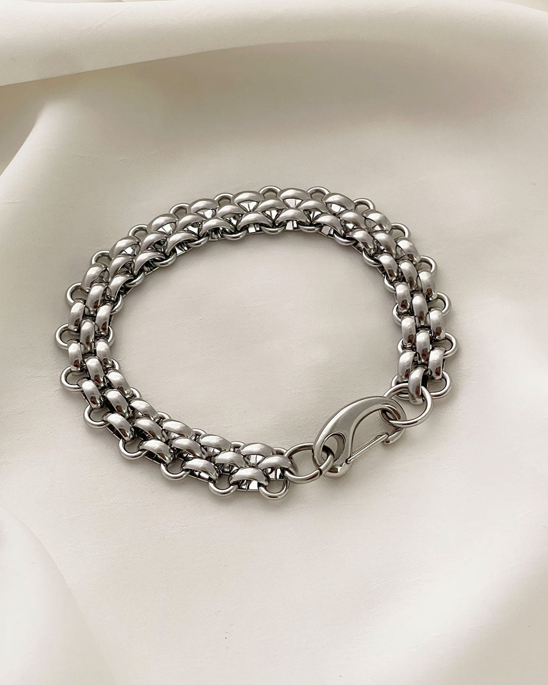 "Palmer" silver chain bracelet on a white surface