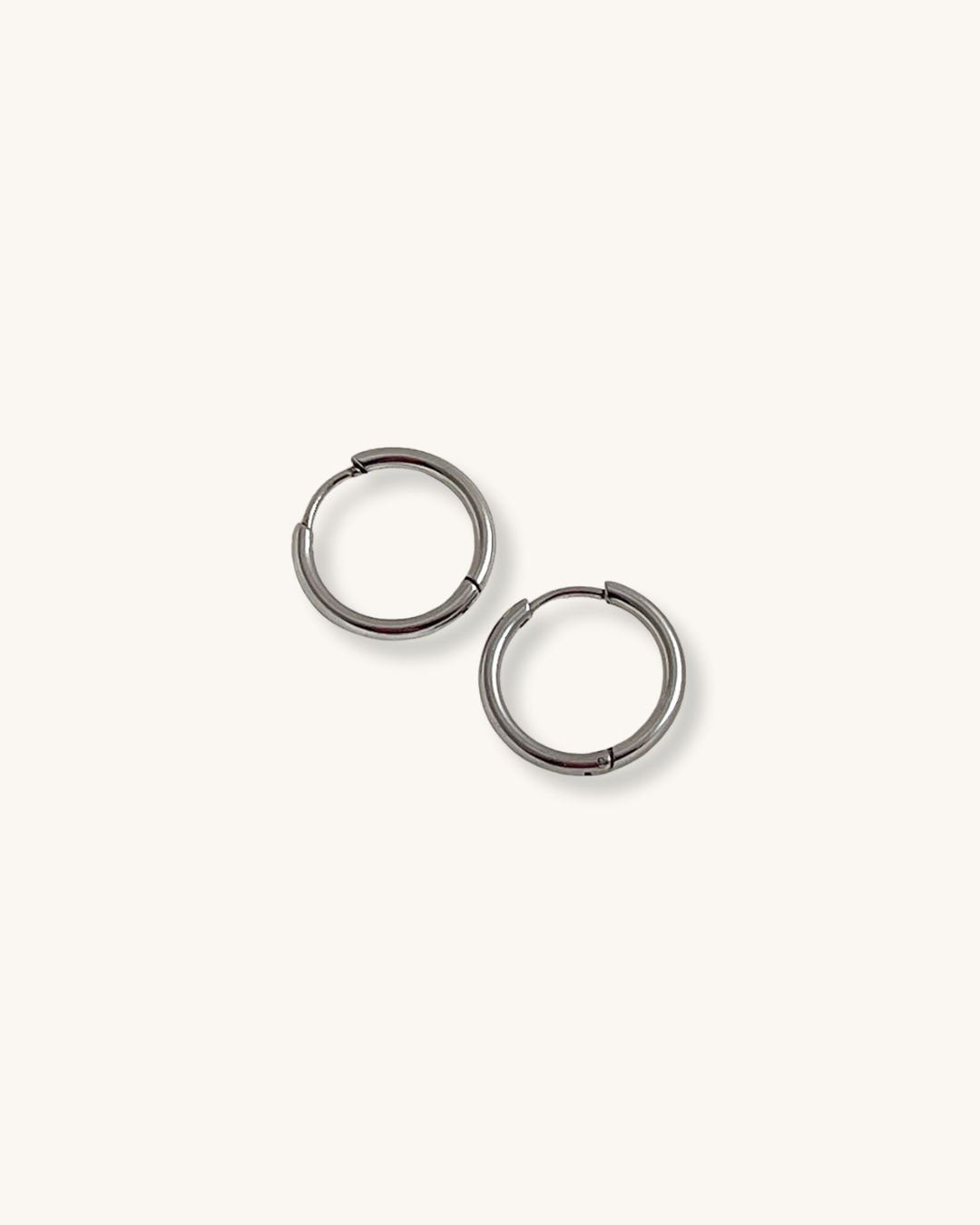 Pair of silver hoop earrings 14mm on a white background