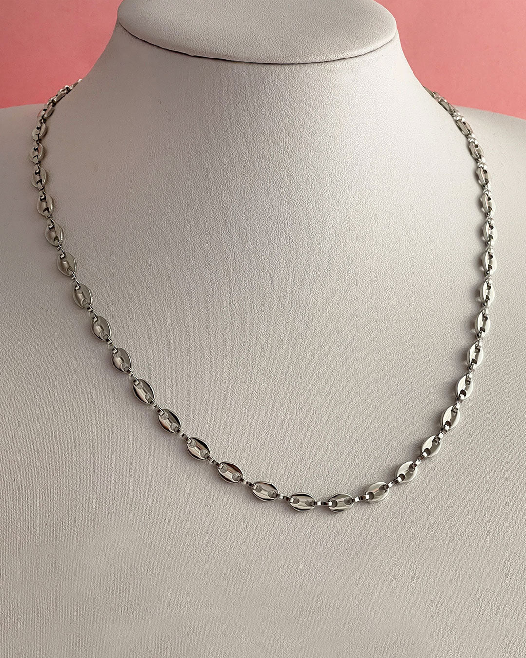 A silver puffy mariner chain necklace made of stainless steel