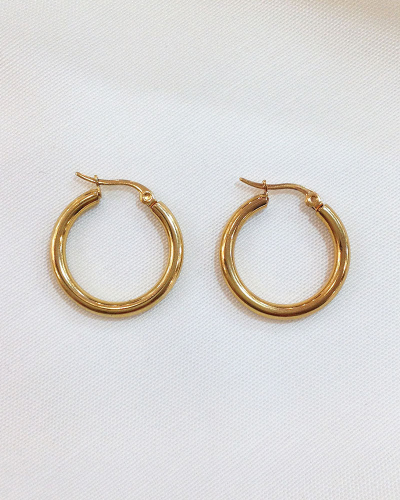 The 25mm Gold Hoop Earrings, a pair of stainless steel hoops in gold