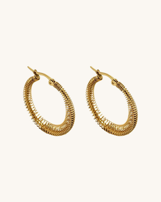 The 40mm Minimalist Gold Hoop Earrings, a pair of stainless steel hoop earrings with wire wrap detail.