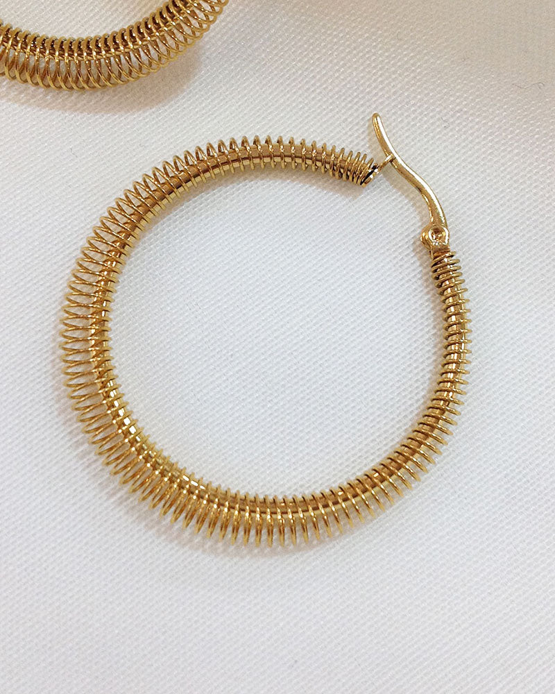 The 40mm Minimalist Gold Hoop Earrings, a pair of stainless steel hoop earrings with wire wrap detail.