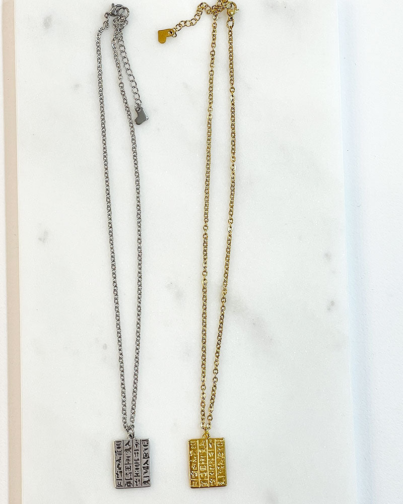 Egyptian style hieroglyph pendant necklace in gold and silver.