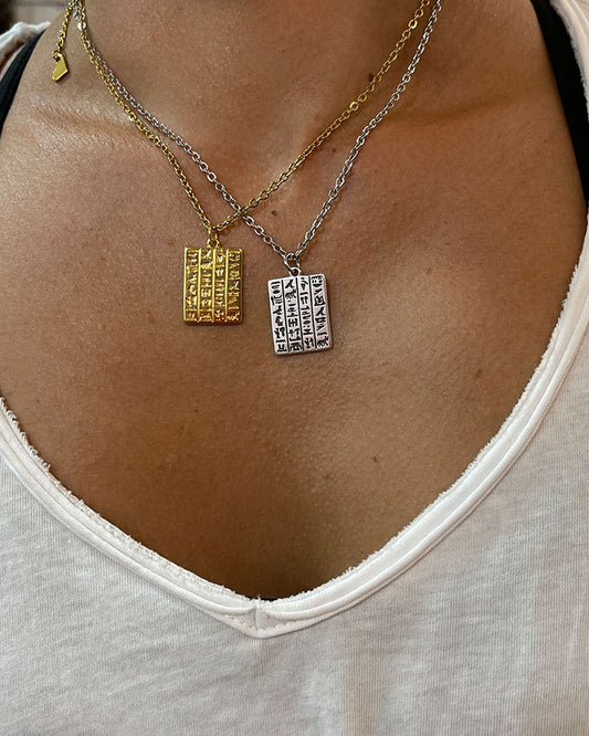 Egyptian style hieroglyph pendant necklace in gold and silver.
