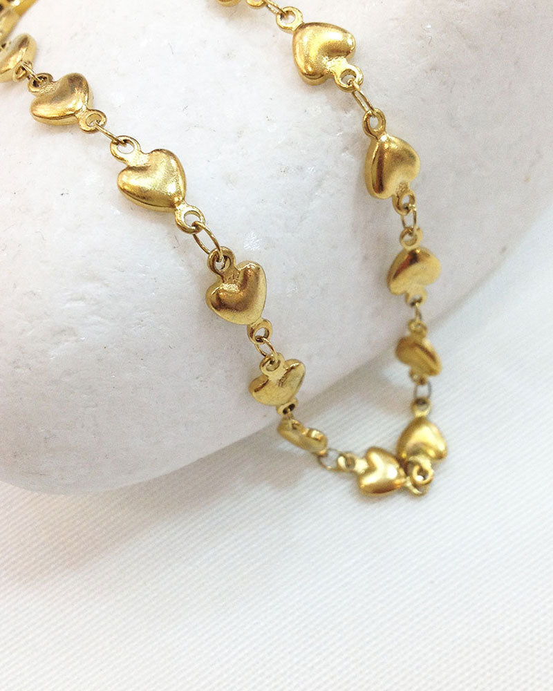 A waterproof Heart Chain Anklet in gold