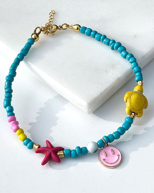 A Pink Smiley Sea Turtle Beaded Anklet