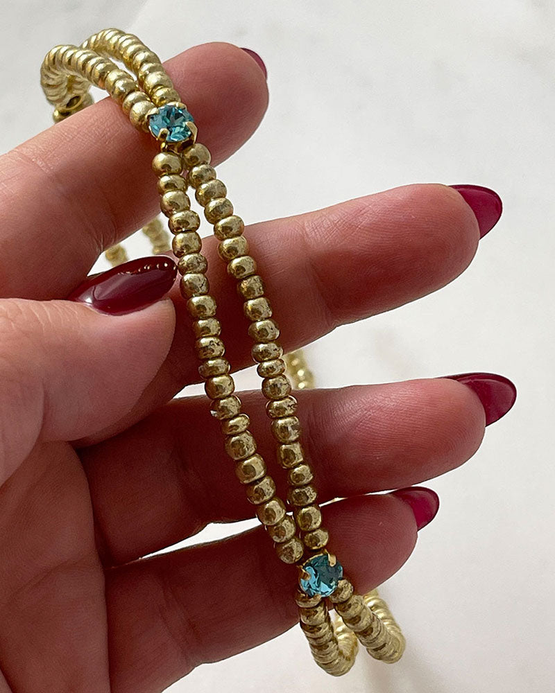 gold bead choker necklace with light turquoise crystals