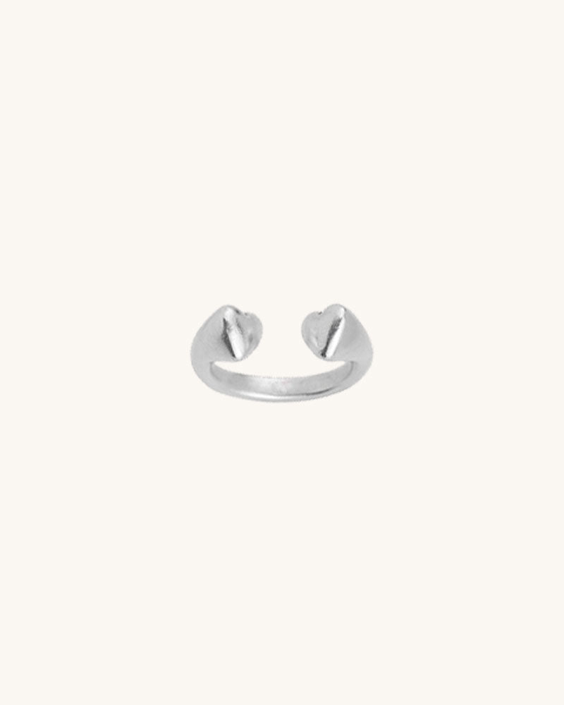 A silver double heart ring with a slightly adjustable band, displayed against a white background.