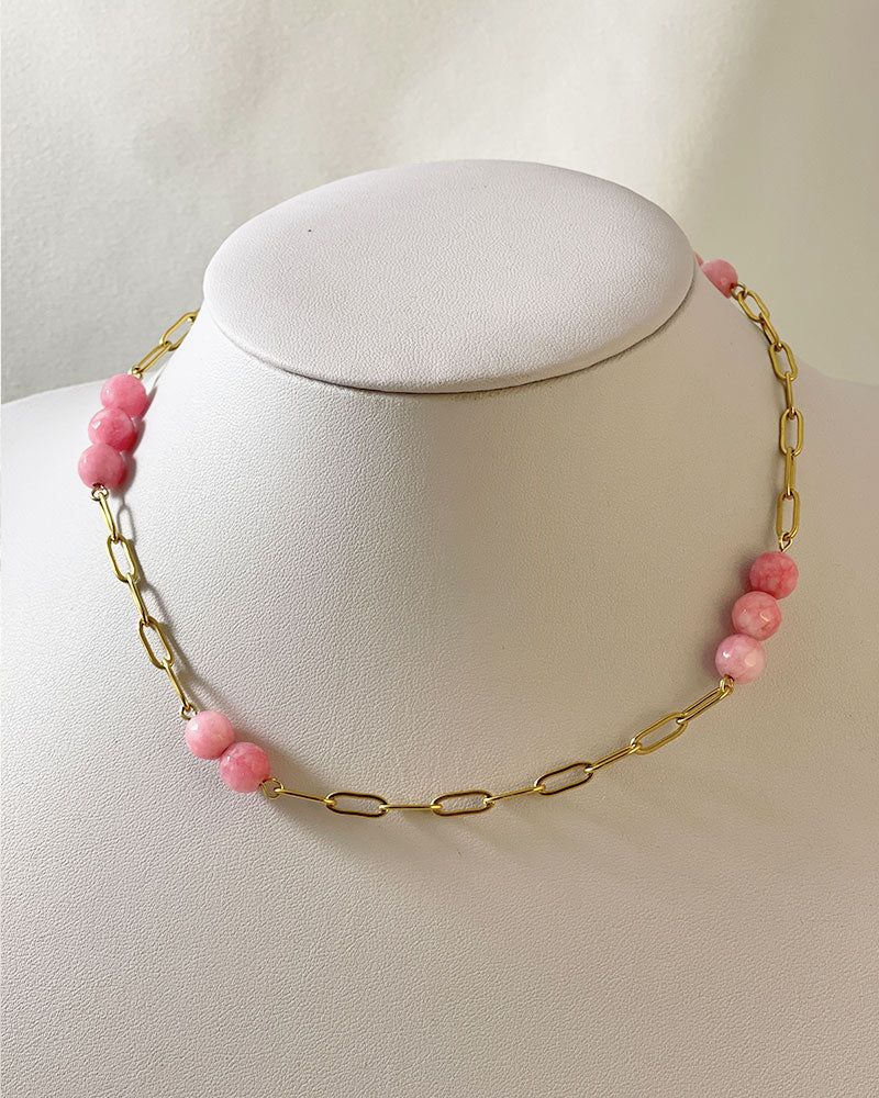 A pink agate statement necklace with a gold paperclip chain