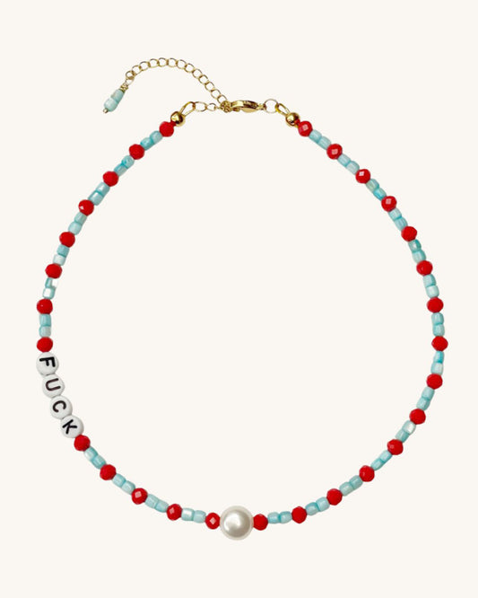 A beaded necklace with turquoise shells and red glass beads.