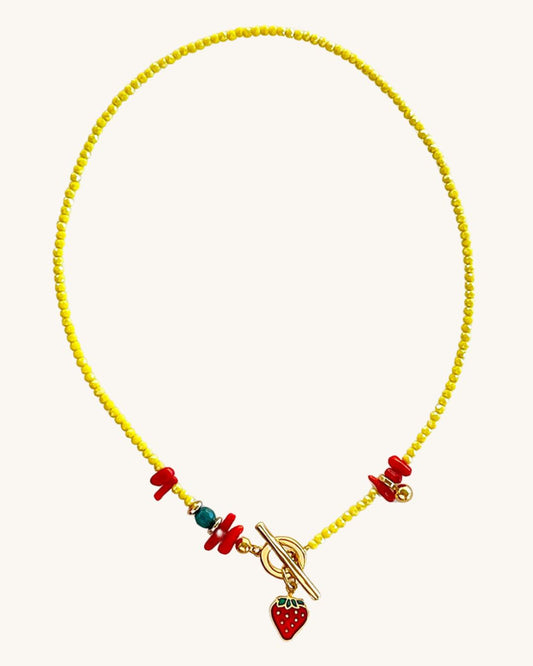 Yellow beaded necklace with stawberry pendant