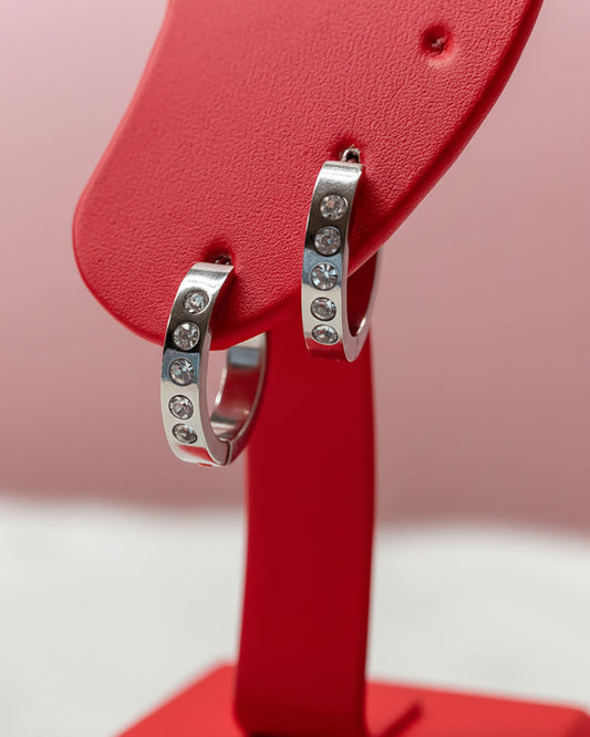 Waterproof silver hoop earrings adorned with crystal cubic zirconia