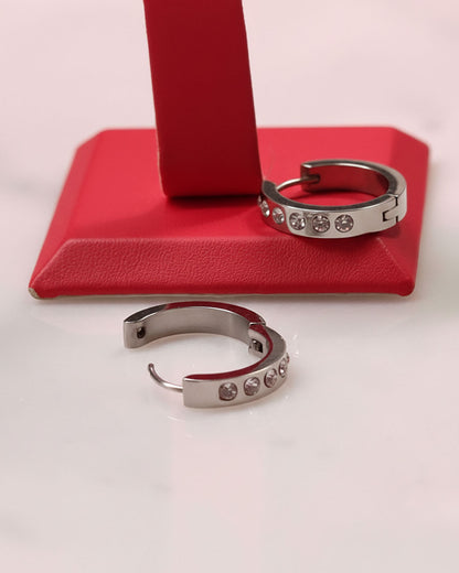 Waterproof silver hoop earrings adorned with crystal cubic zirconia