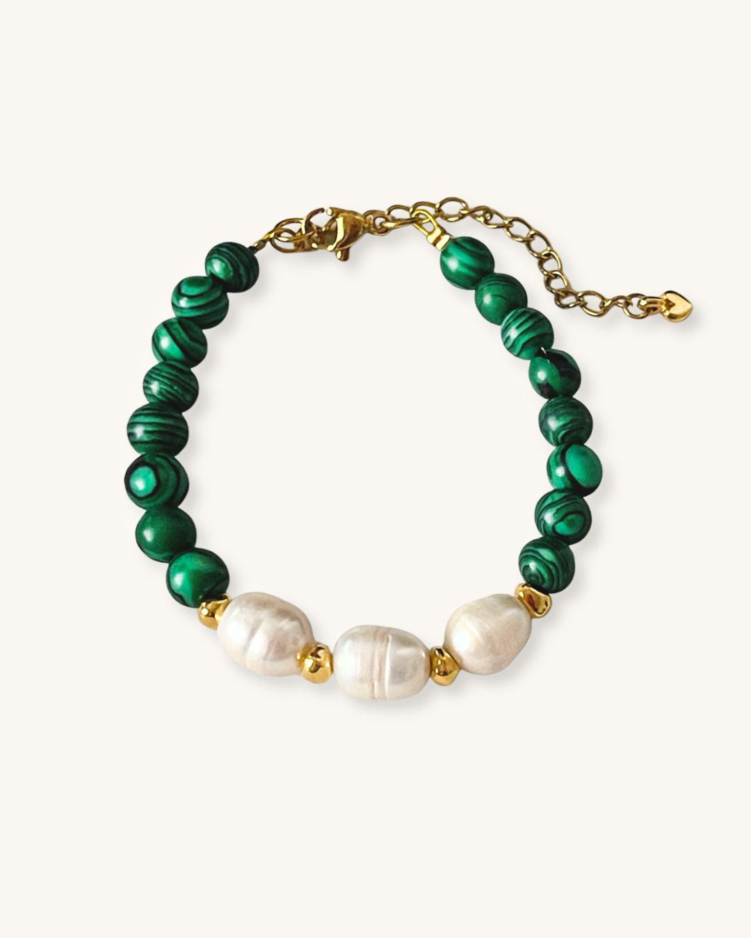 A handmade green malachite beaded bracelet with freshwater pearls. The bracelet has a gold stainless steel lobster clasp