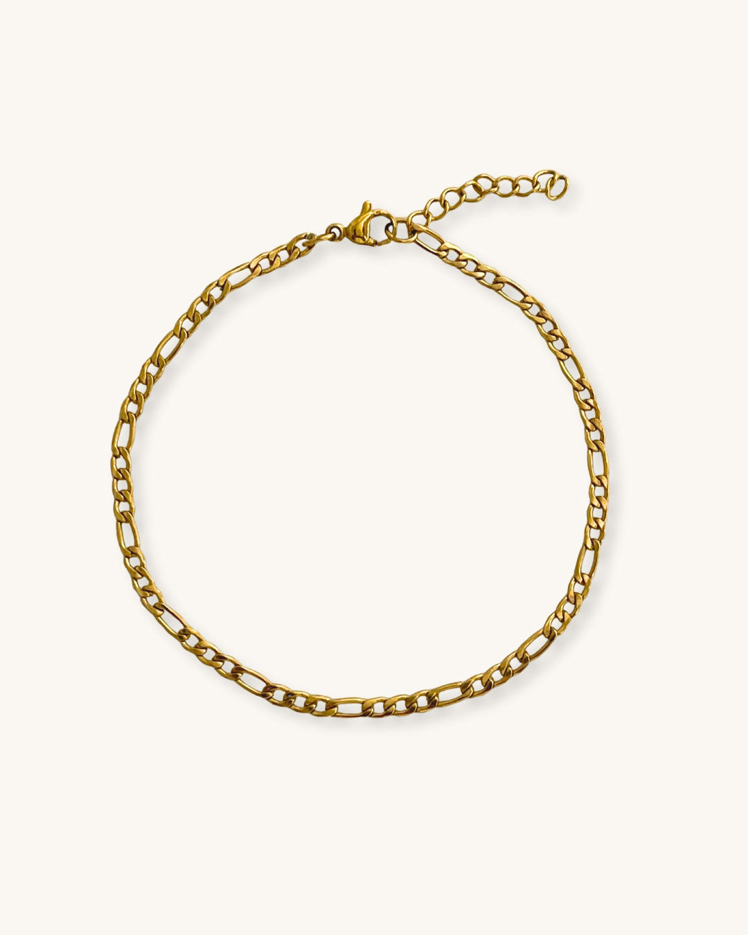 A delicate figaro chain bracelet in gold