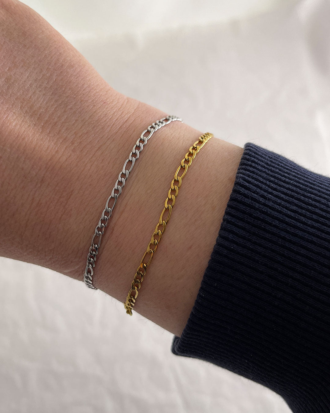 A delicate figaro chain bracelet in gold