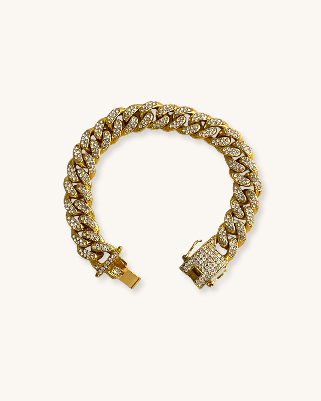Gold chain bracelet full of cubic zirconia on a white background