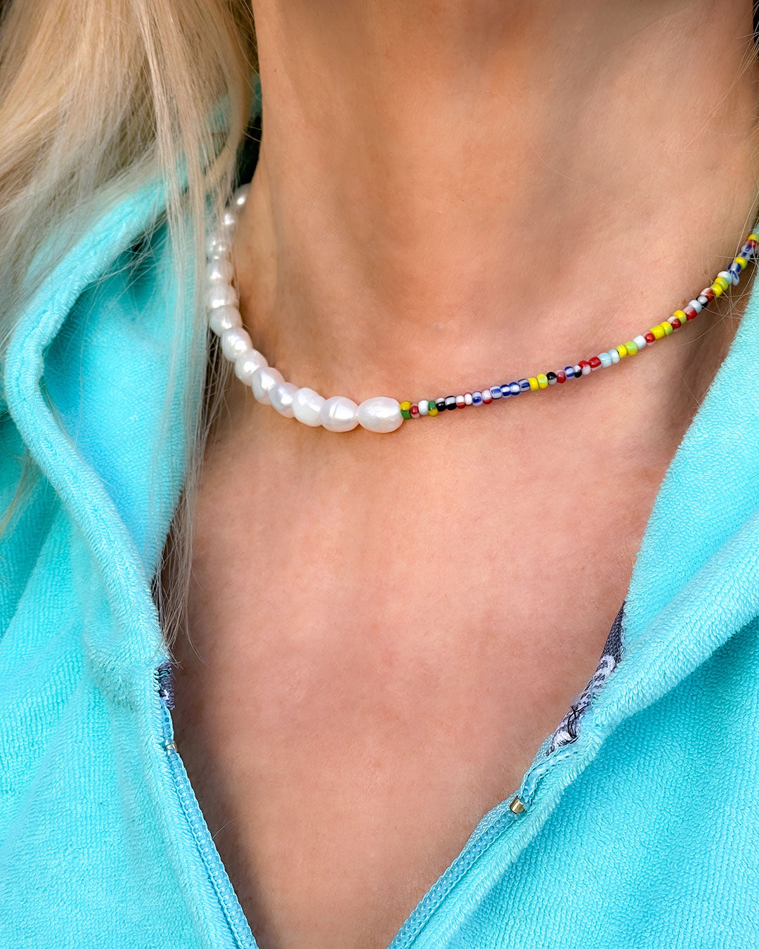 The Venetia Necklace is a half colorful beads and half pearls beaded necklace perfect for layering