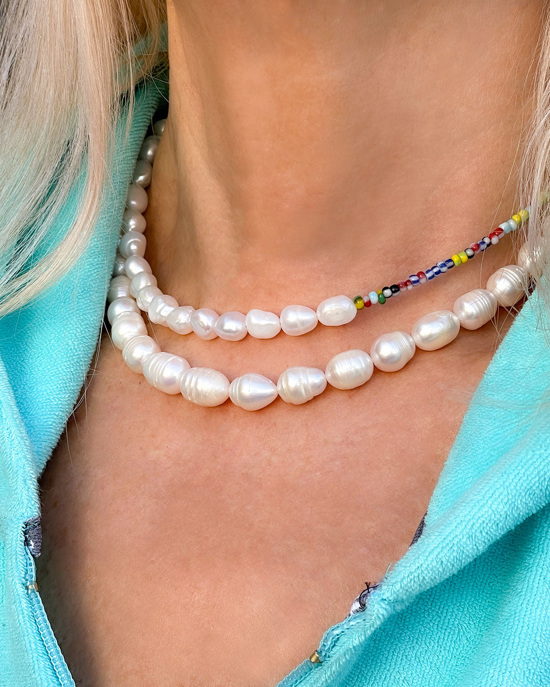 The Venetia Necklace is a half colorful beads and half pearls beaded necklace perfect for layering