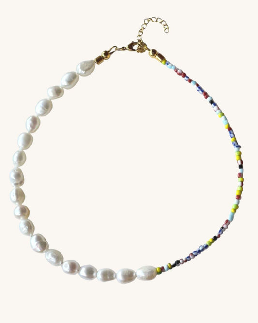 The Venetia Necklace is a half colorful beads and half pearls beaded necklace perfect for layering