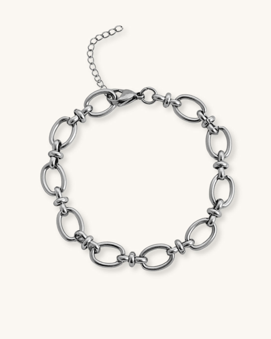 Silver oval link chain bracelet on a white background