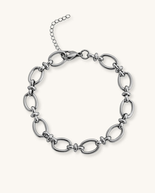 Silver oval link chain bracelet on a white background
