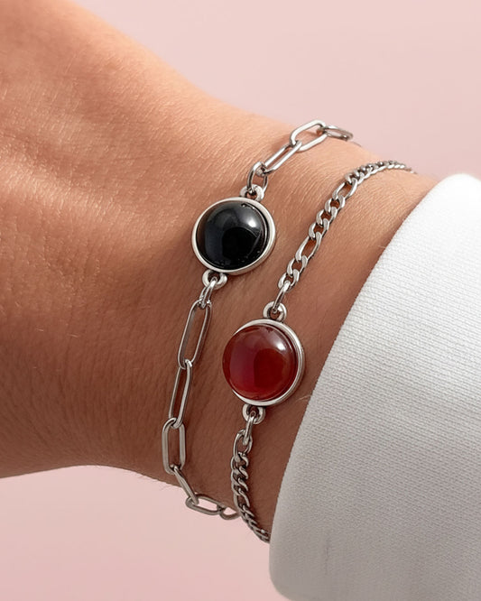 Bracelet with black onyx and red carnelian stones on a wrist