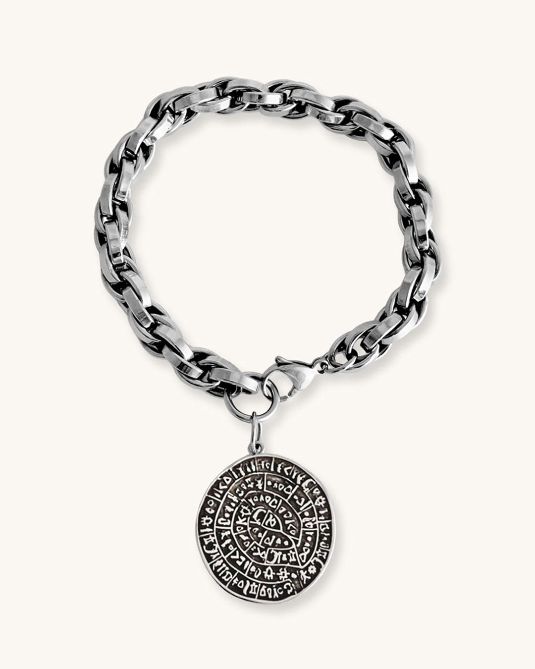 Silver chunky chain bracelet with a round Phaistos disc charm on a white background
