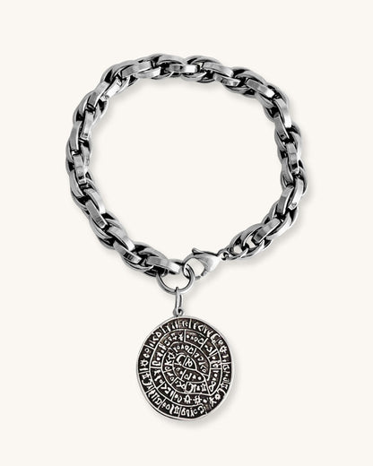Silver chunky chain bracelet with a round Phaistos disc charm on a white background