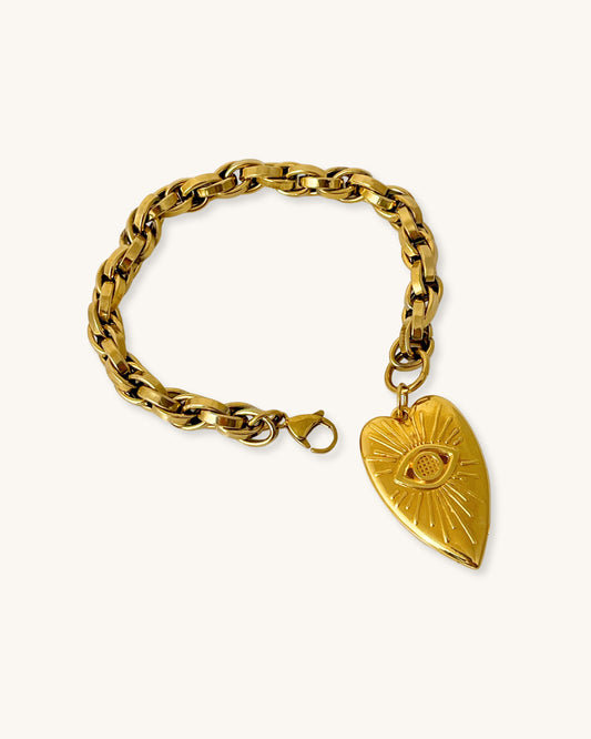 A close-up look at our evil eye heart charm bracelet with a gold chunky chain