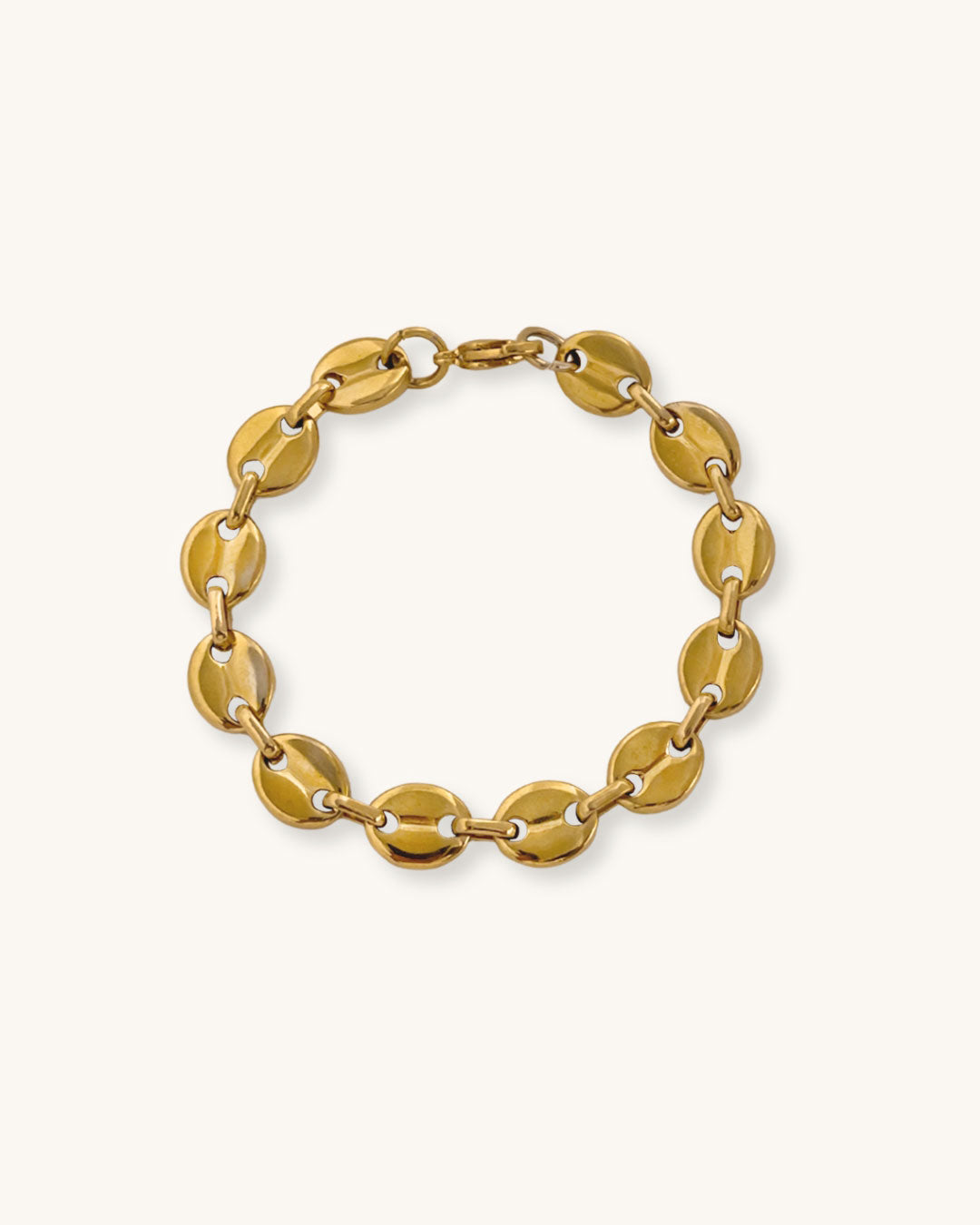 Gold mariner chain bracelet on a white background