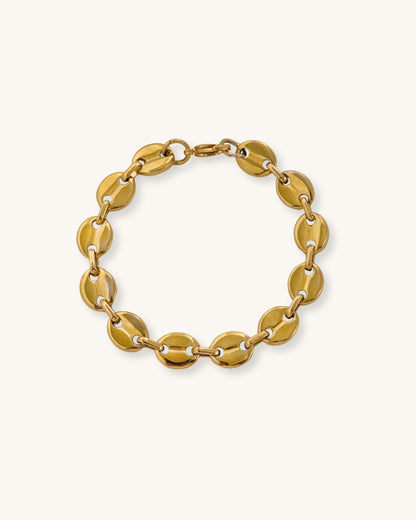 Gold mariner chain bracelet on a white background