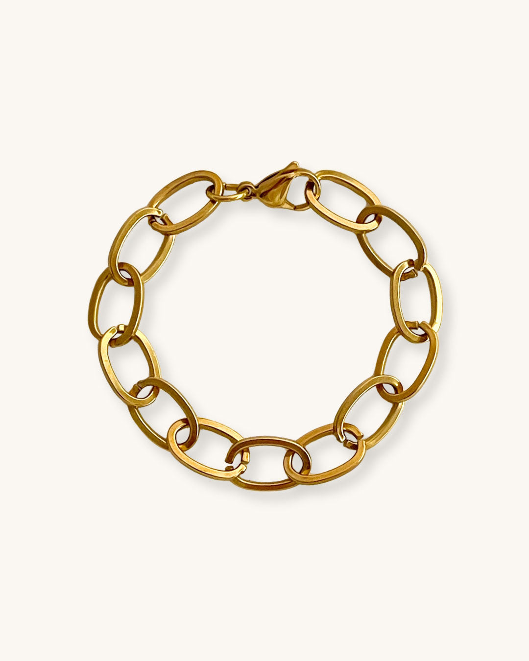 Chunky oval links chain bracelet in gold on a white background