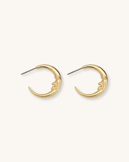 The Crescent Moon Earrings, a pair of half-moon-shaped gold earrings