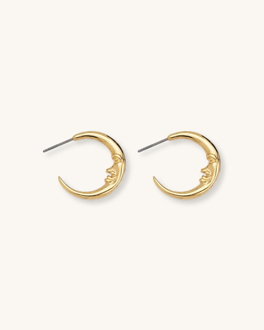 The Crescent Moon Earrings, a pair of half-moon-shaped gold earrings