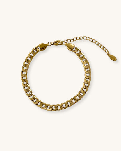 Waterproof curb chain bracelet in gold on a neutral background
