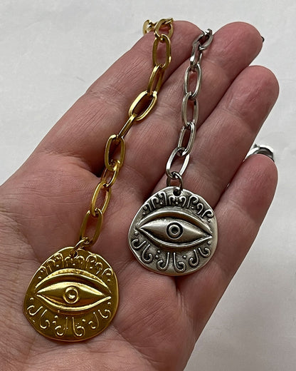 Evil eye charm bracelet with paperclip chain and a round eye charm in gold and silver