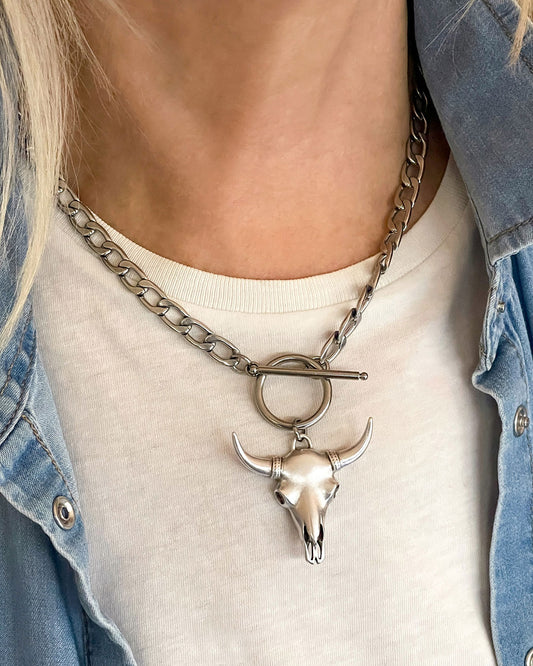 Model wearing a Longhorn Bull Skull Necklace in silver with a toggle closure