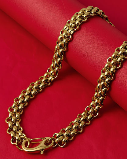 Gold chainmail necklace with a large lobster clasp on a red background