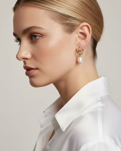 Woman wearing gold hoop earrings with real freshwater pearls