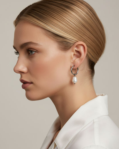 Woman wearing silver hoop earrings with real freshwater pearls