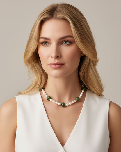 Model wearing a handmade necklace with freshwater pearls and green ceramic beads