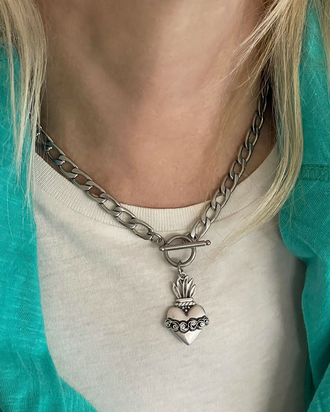 Model wearing a Sacred Heart Toggle Necklace in silver